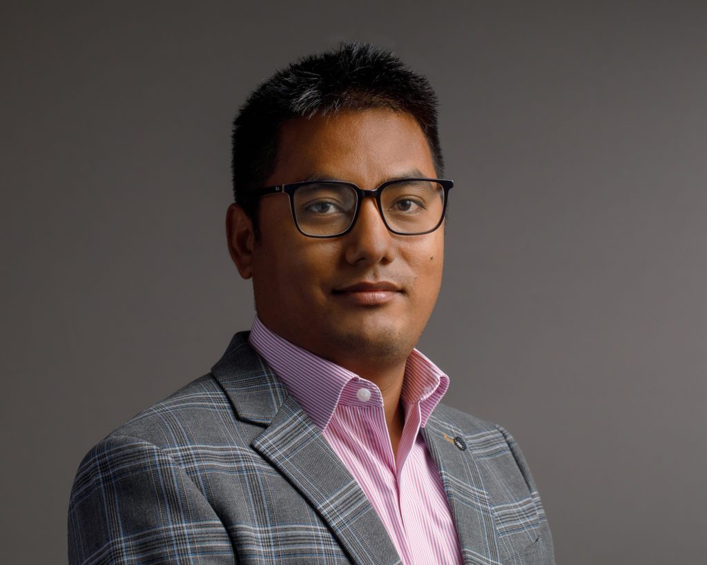Portrait of Roman Shrestha, PhD, MPH, Director of the Shrestha Lab